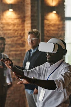 Man experiencing virtual reality with headset in office setting, engaging with technology.